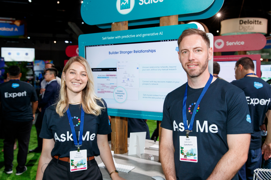 Woman and man standing in front of a demo screen