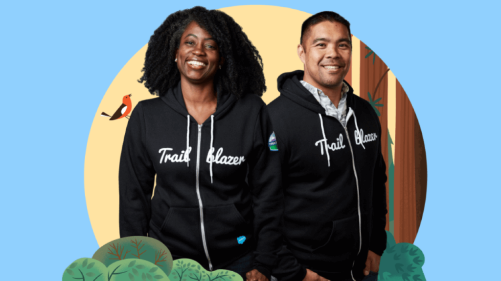 Two Salesforce Trailblazers posing in a nature setting.	