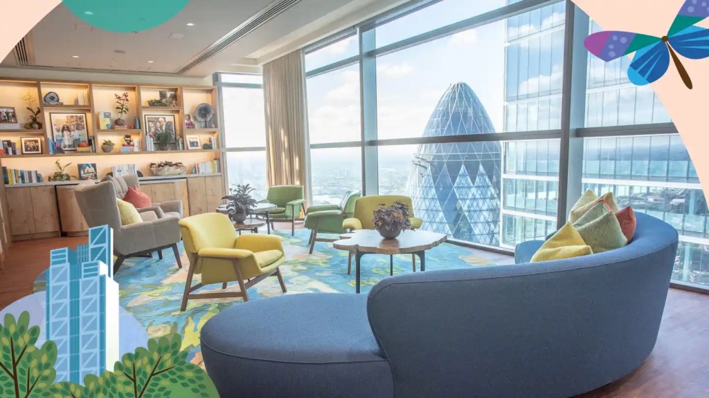 Modern colorful furnishings create a living room environment with a cityscape view on the Ohana Floor in London.