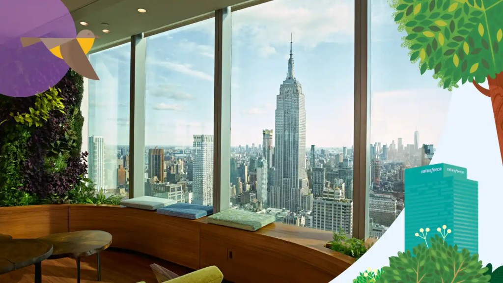 Sleek wood window seating and foilage with a view of the Empire State Building from the Ohana Floor in New York City.