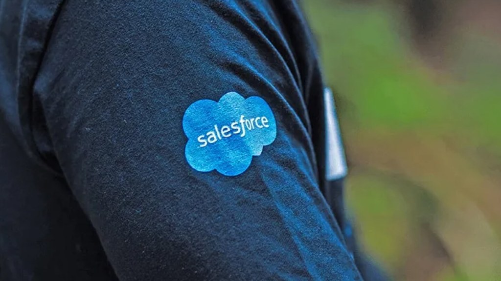 The Salesforce logo on the sleeve of a shirt.	